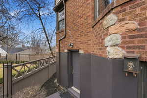View of side of property featuring brick siding