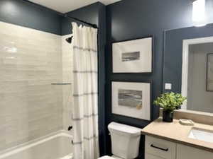 Bathroom with shower / tub combo and vanity