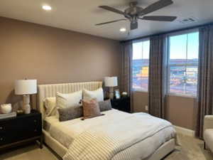 Bedroom with a ceiling fan and recessed lighting