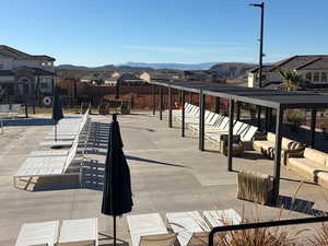 View of community with a residential view, a mountain view, and a patio
