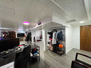 Office area with wood finished floors and baseboards