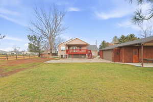 Rear view of house with concrete driveway, an attached garage, and a residential view