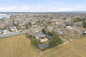 Aerial overview of property's location with nearby suburban area and property parcel outlined