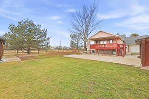 Fenced backyard featuring stairs and a residential view