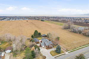 Aerial view of sparsely populated area featuring farmland and nearby suburban area