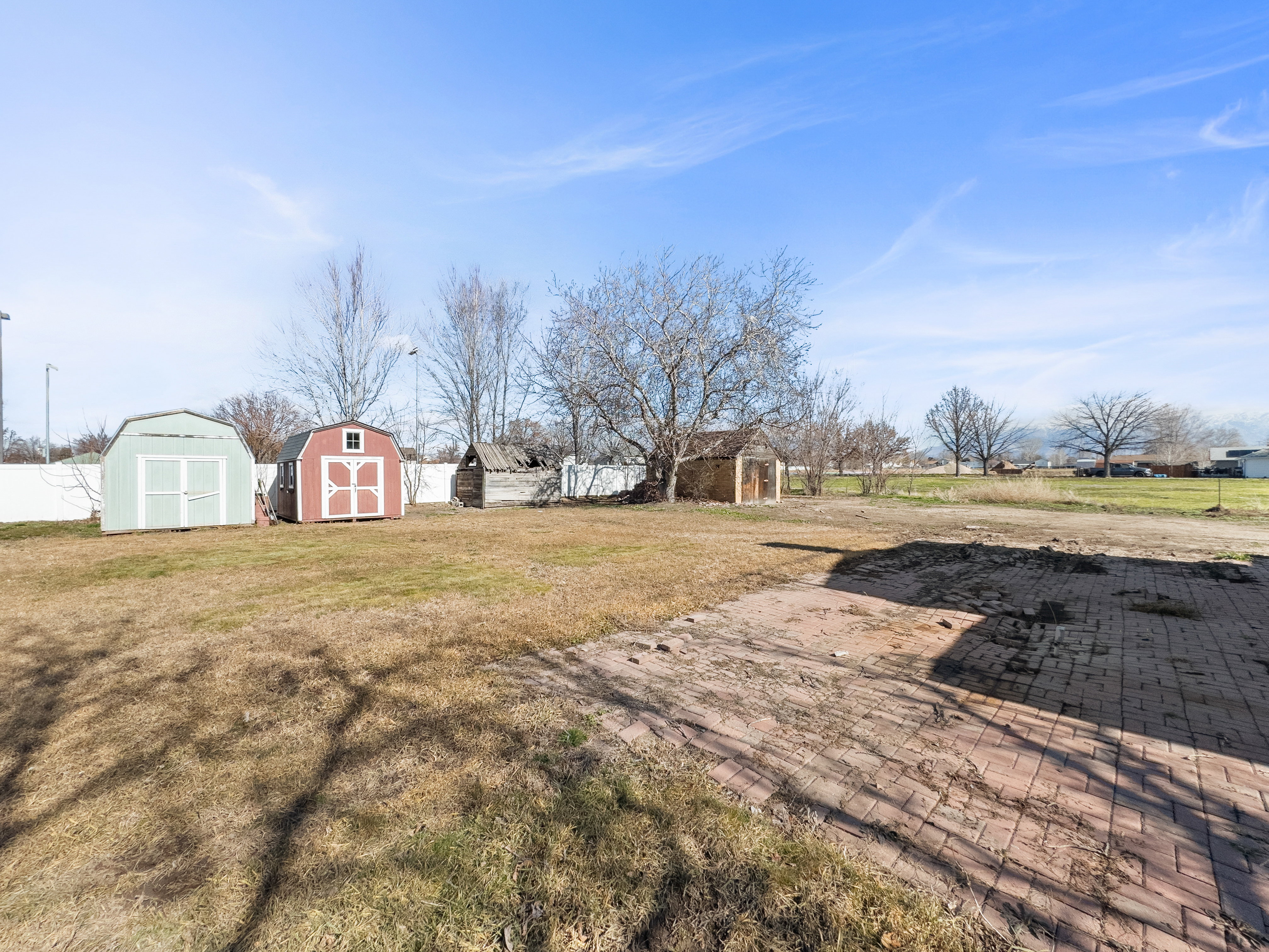 View of  lawn with a storage units