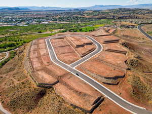 Aerial view of property and surrounding area with mountains
