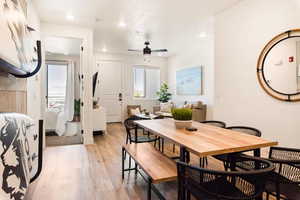 Dining area with light wood-style flooring, a ceiling fan, and recessed lighting
