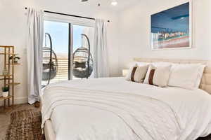 Carpeted bedroom with access to exterior