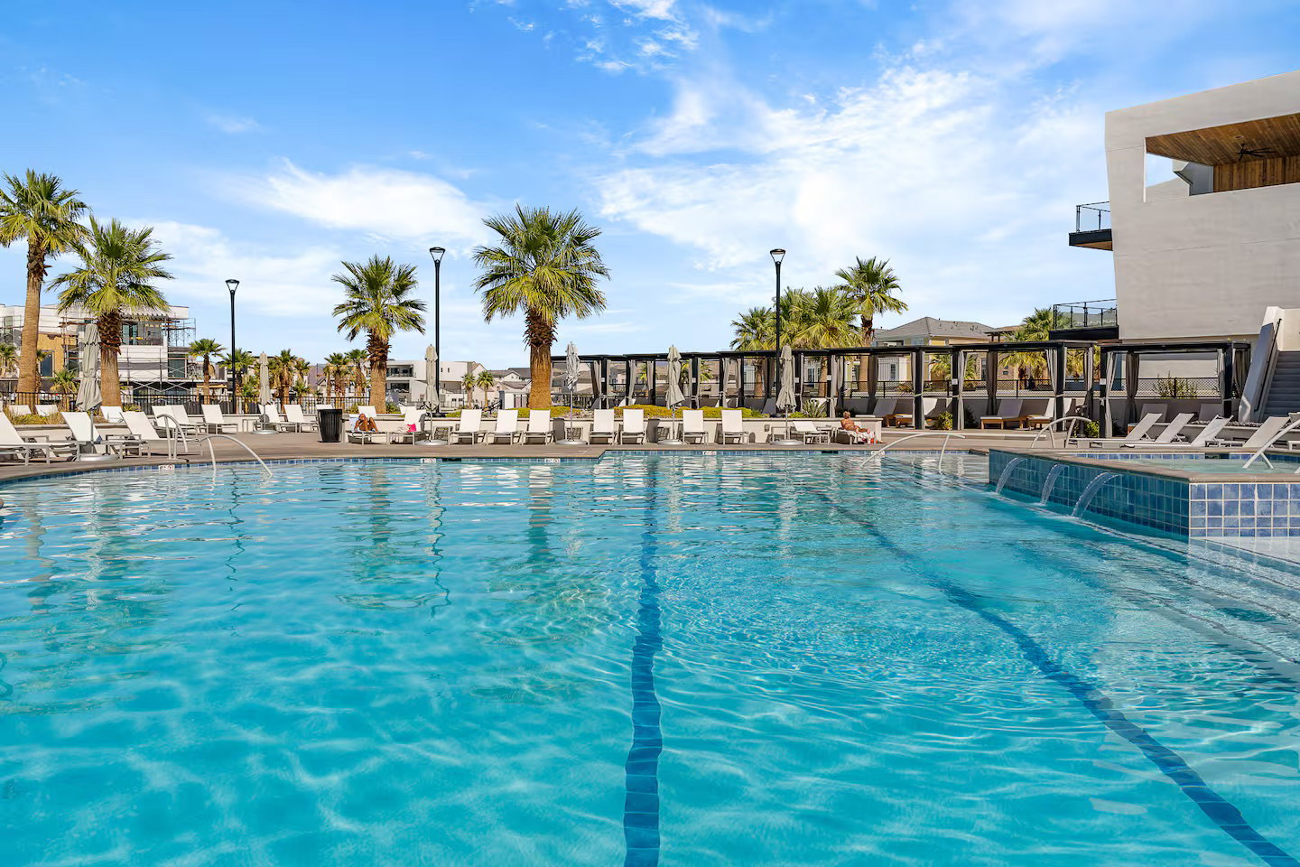 Community pool featuring a patio