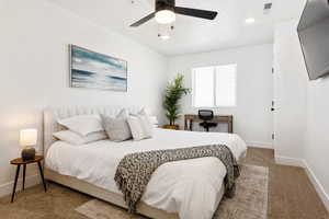 Bedroom featuring light carpet and ceiling fan