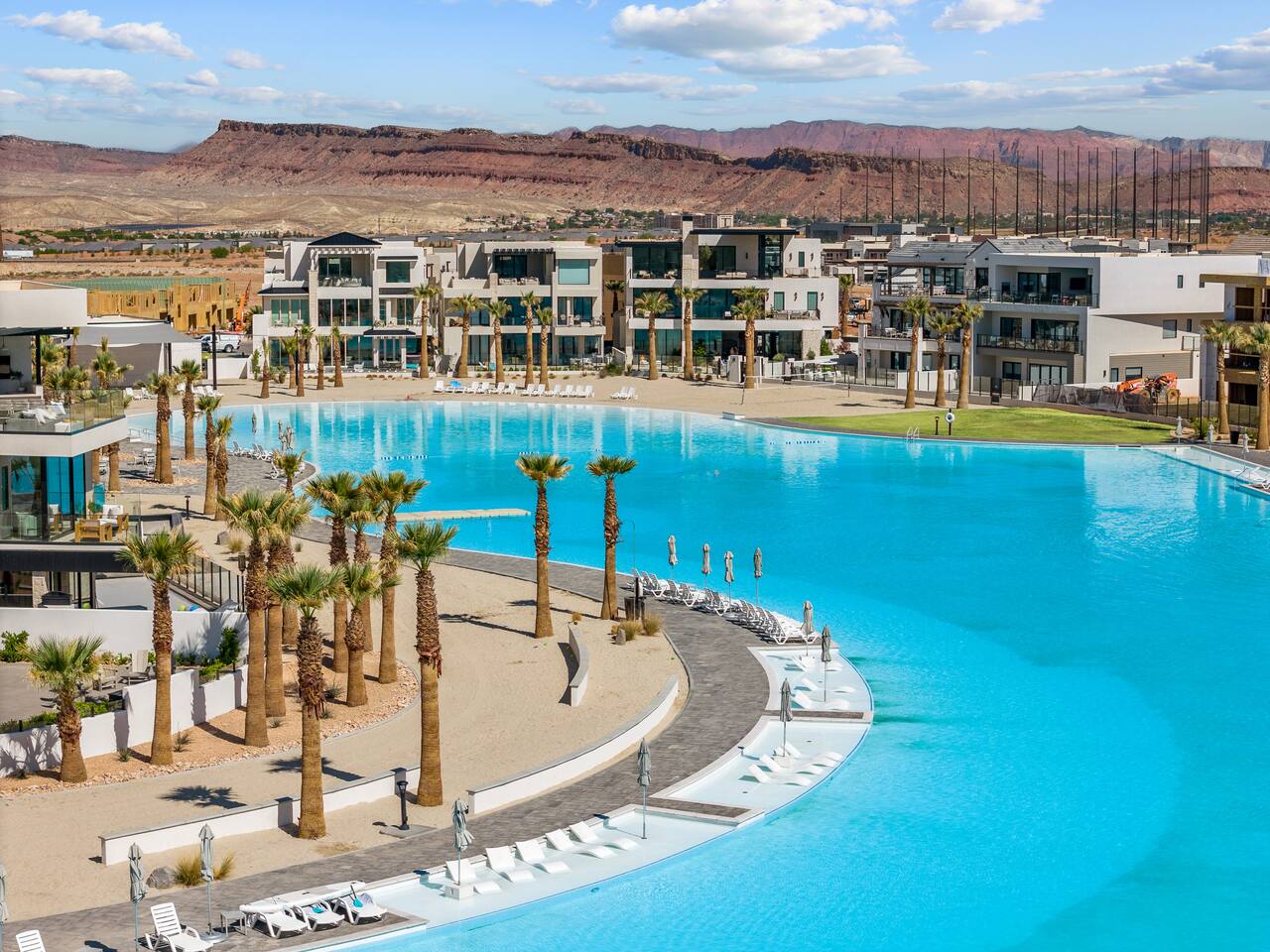 Community pool featuring a mountain view, a patio area, and a residential view