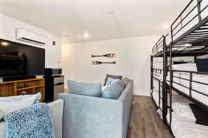 Living room featuring wood finished floors and recessed lighting