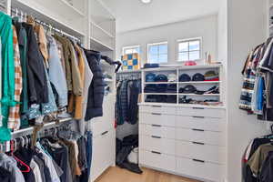 Walk in closet featuring light wood finished floors