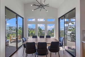 Dining room featuring a chandelier and lofted ceiling