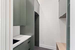 Laundry room featuring baseboards