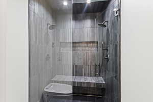 Bathroom featuring walk in shower