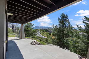 View of patio / terrace featuring stairway and a mountain view