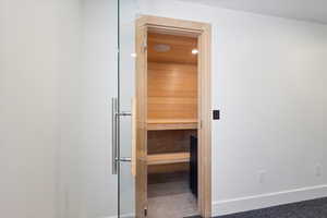 Relaxing sauna featuring baseboards and recessed lighting