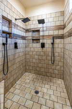 Bathroom featuring tiled shower