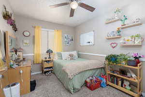 Bedroom featuring carpet and ceiling fan