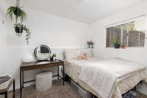 Carpeted bedroom with baseboards
