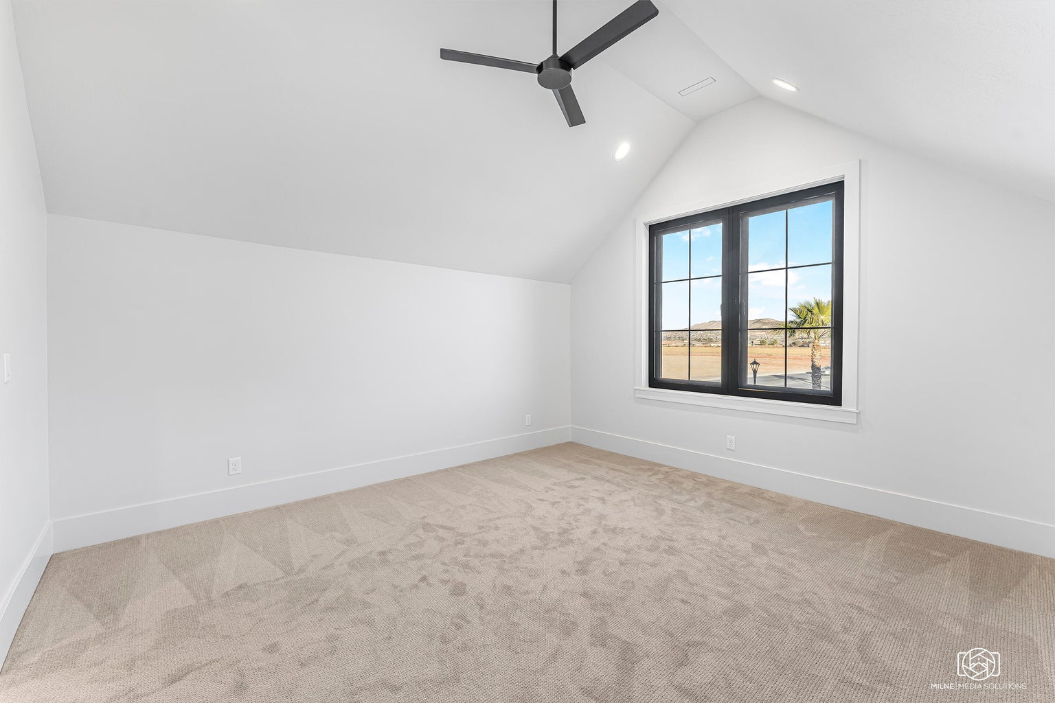 Additional living space with light colored carpet, a ceiling fan, and recessed lighting
