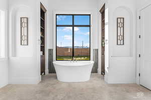 Full bathroom featuring a freestanding tub