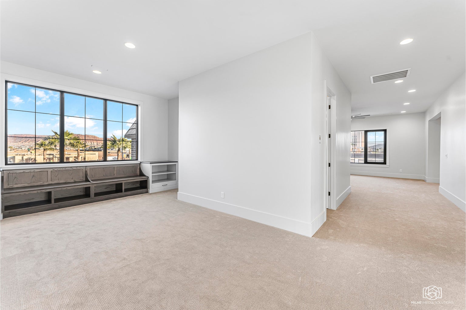 Spare room featuring light colored carpet and recessed lighting