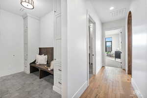 Hallway featuring baseboards and recessed lighting