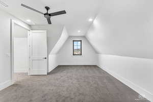 Bonus room with light carpet, lofted ceiling, ceiling fan, and recessed lighting