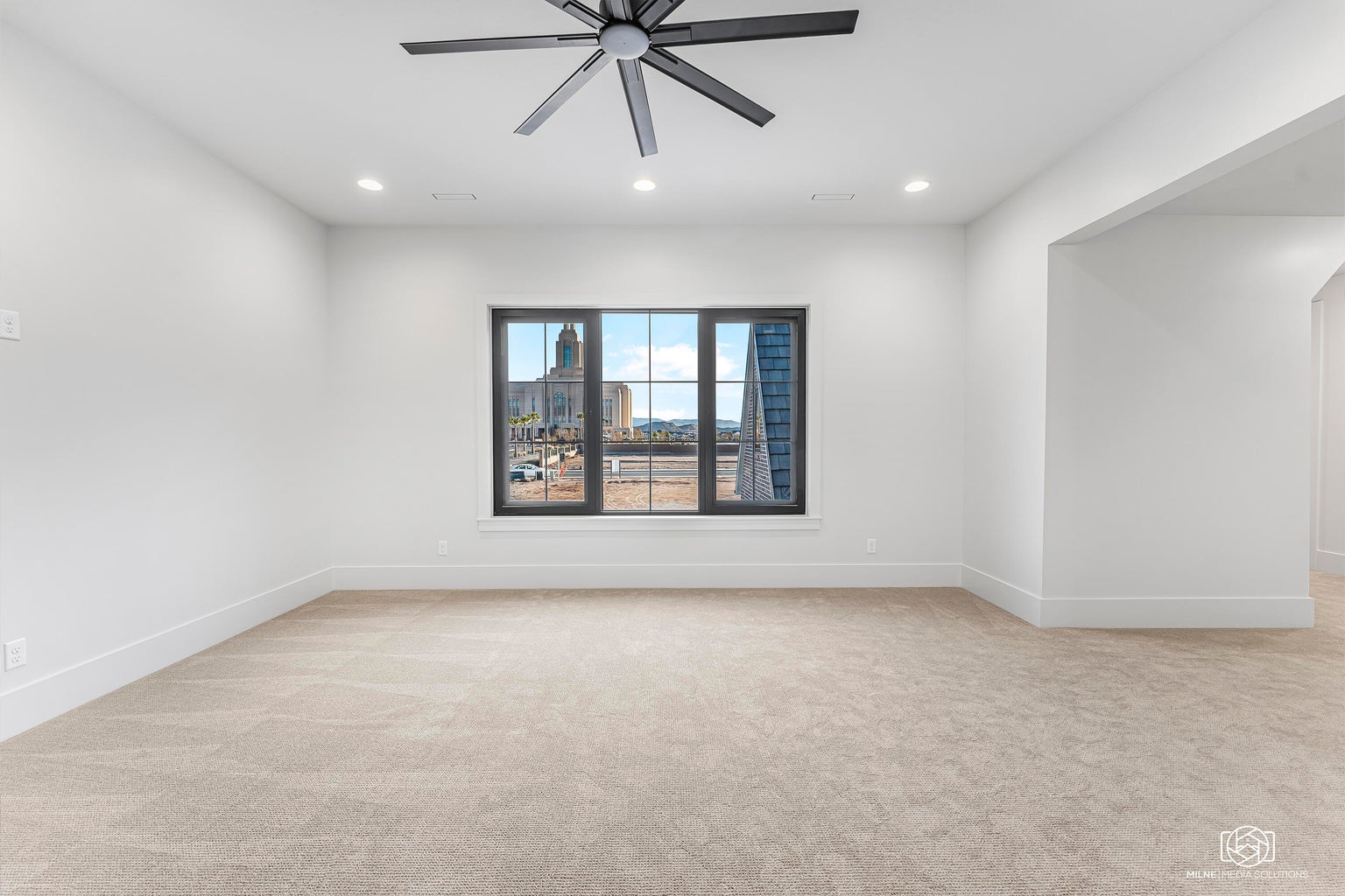 Spare room with light carpet, a ceiling fan, and recessed lighting