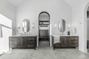 Bathroom with vaulted ceiling and two vanities