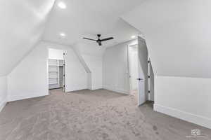 Additional living space featuring light carpet, vaulted ceiling, recessed lighting, and a ceiling fan