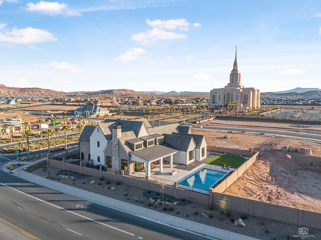 Aerial view of a mountainous background and a pool area
