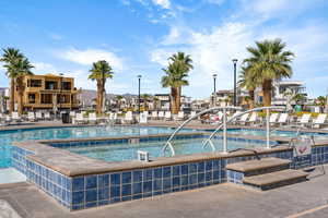 Community pool featuring a residential view and a patio
