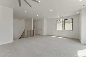 Unfurnished room featuring carpet flooring, recessed lighting, and a ceiling fan