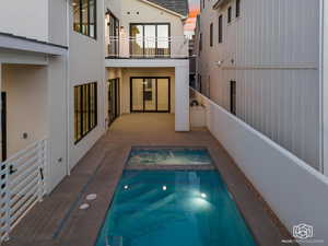 Relaxing pool / spa with a balcony