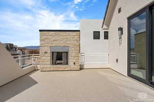 View of patio / terrace with an outdoor stone fireplace