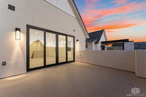 Patio terrace at dusk with a patio area