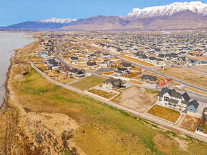 Aerial perspective of suburban area featuring a mountainous background