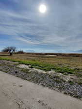 View of yard with a rural view and a mountain view