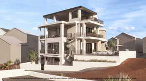 View of building exterior with stairs and a fenced front yard