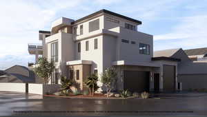 View of building exterior with a garage and driveway