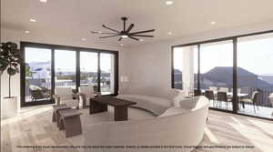 Living area featuring a ceiling fan, light wood-style floors, and recessed lighting