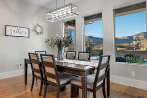 Dining room with light wood-type flooring and a mountain view