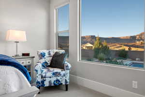 Carpeted bedroom with a mountain view