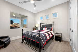 Carpeted bedroom featuring a ceiling fan and recessed lighting
