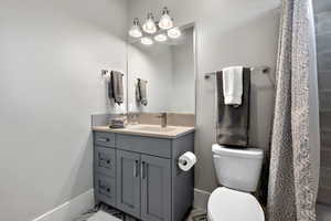 Full bath featuring vanity and a shower with curtain