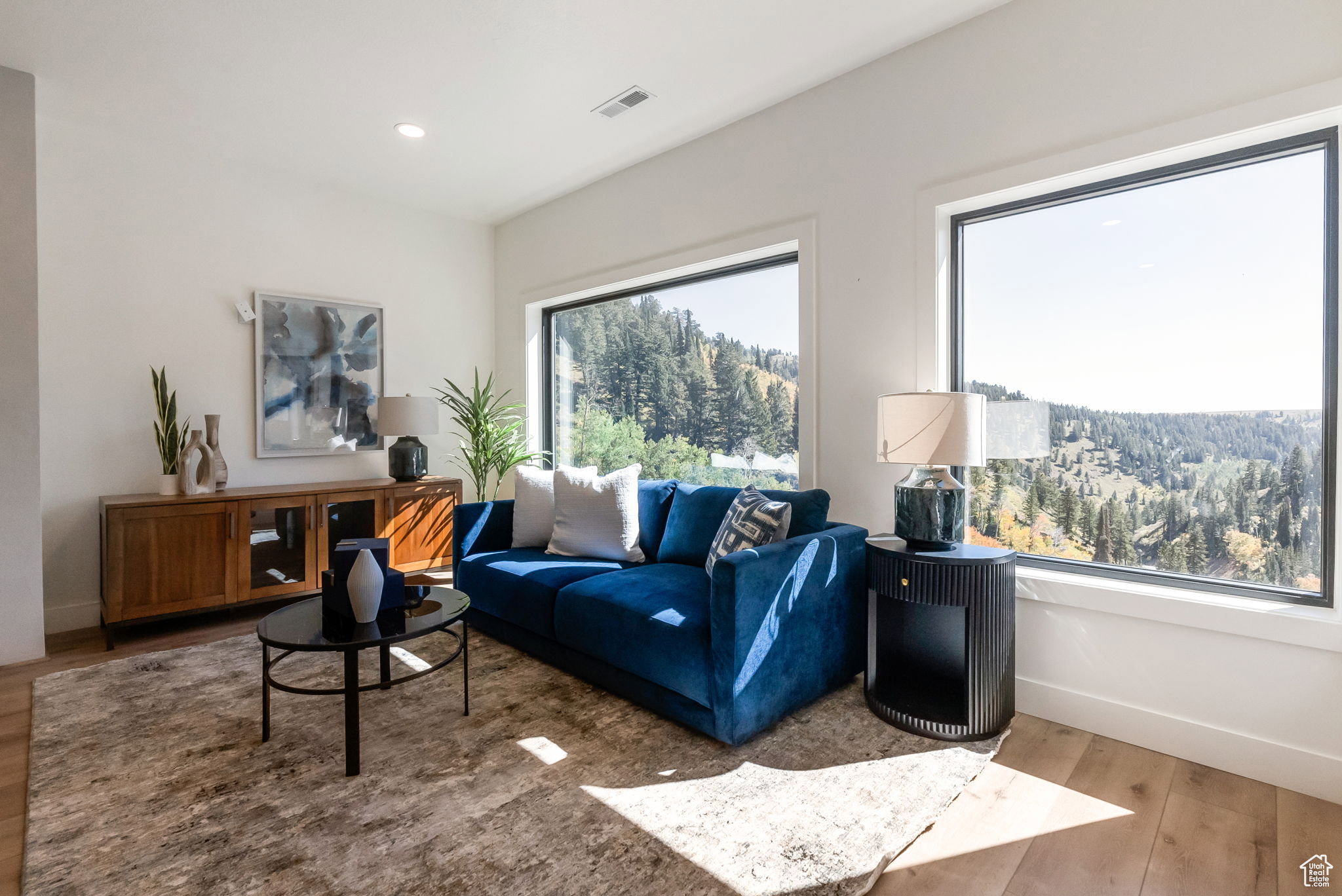 Living room featuring wood finished floors and recessed lighting